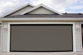 Pictured is a brown 8'x7' & 16'x7' lifestyle with black super screen. Electric Roll Up Garage Screens Michele S Hide Away Screens