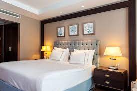standard bedroom lighting with two bedside table lamps and ceiling spotlights from kaya palazzo resort yatak odasi aydinlatma aydinlatma tasarimi yatak odasi