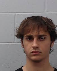 Quinn, Sloan Andrew was booked into the Hays County Jail