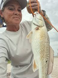 My app was right about there being low fish activity today. Found a little  red and a small gar. David found a flounder. Best part was fishing with the  girls and running