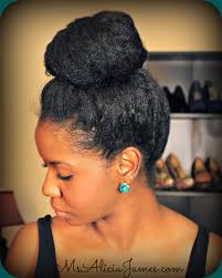 Natural hair bun using jumbo braiding hair as a protective updo style for black women. Big High Bun On Natural Hair How To Take Care Of Natural Hair