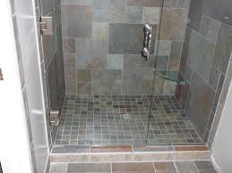 Stacked niches are fitted with a polished nickel shower head mounted gray marble mini brick tiles framed by gray marble shower surround tiles. Bathroom Shower Base Tile Ideas Novocom Top