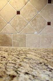 2.6 go elegant with a backsplash of marble; Backsplash With St Cecilia Granite Save To Ideabook Email Photo Kitchen Tiles Backsplash Trendy Kitchen Backsplash Travertine Backsplash