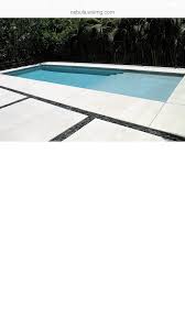 Pool Surround With Concrete Black River Rock Pool Pavers Pool Decking Concrete River Rock Patio
