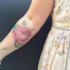 However, the negative space tattoo requires much more ink and time than a regular design. Cross Stitch Red Rose Tattoo On The Right Inner