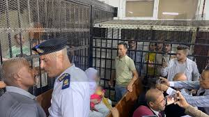 المشاهد الأولى لمحاكمة المتهمة بقتل زوجها وأطفاله الـ6 من زوجته الأولى  بقرية دلجا في المنيا - تصوير: إسلام فهمي