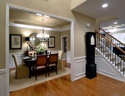This formal living room is painted white and is brought to life by gold accents, seen in the light fixture, ottoman and artwork. Formal Dining Room Paint Ideas Gallery House Design Apartment Dining Room Dining Room Colors Modern Dining Room