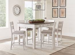 Dining table pendants really center the space and give it a focal point, much like kitchen even if you aren't relying on the dining table light for illumination, it can be another opportunity to additionally, this might be a case when you opt to hang the fixture outside the typically recommended heights. Kyle Light 5 Piece Counter Height Dining Set By Standard Furniture Furniturepick