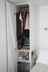 An exposed storage unit like this one is perfect for those with a small, monochrome wardrobe. Becoming Home A Wardrobe Tour Assortment Diy Bedroom Storage Small Bedroom Storage Small Space Bedroom