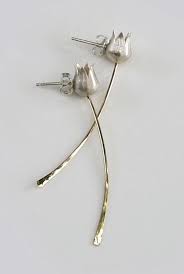 Wooden armchairs with tweed upholstery, a hardwood table with hairpin metal legs. 100 Stud Minimalist Earrings Ideas Minimalist Earrings Earrings Jewelry