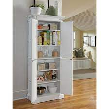 Free standing corner pantry cabinet. Home Styles Furniture Americana White Pantry 5004 692 Bellacor In 2021 White Pantry Pantry Storage Cabinet White Kitchen Storage