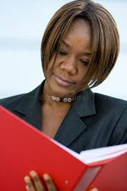 Person Holding White Book Front Building Stock Photos
