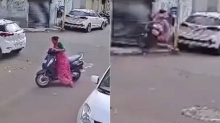 Woman learning to ride an Activa loses control during U-turn, crashes into shop shutter in Rajkot; CCTV video goes viral