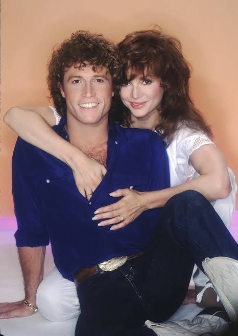 Andy Gibb and his girlfriend Victoria Principal photographed by Harry Langdon, 1981.