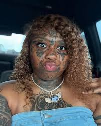 A woman is gaining attention online for her facial tattoos. She's recently  turned her life around, leaving behind a street lifestyle and securing a  job at Walmart. Big props to her for