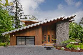 Large expanses of glass (windows, doors, etc) often appear in modern house plans and help to aid in energy efficiency as well as indoor/outdoor flow. 75 Beautiful Exterior Home With A Butterfly Roof Pictures Ideas August 2021 Houzz