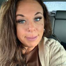 Who can replace a water pump behind the timing cover in a car in Elyria?