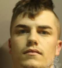 Banned driver who drove at woman in car park jailed