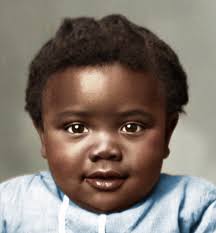A mother holds her baby close for a studio portrait. Taken by photographer  W. J. Ramsey in Gainesville, Georgia, early 20th century.