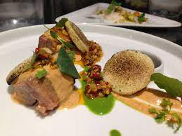 lamb arepa chile de arbol peanut salsa coconut mole at taste of americas dinner with aaron sanchez and javier plascencia during the la food latin food arepas