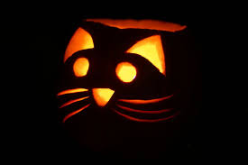Draw two curved lines next to each other for the black cat's eyes. Kitty Jack O Lantern Pumpkin Carving Cat Pumpkin Halloween Diy Crafts