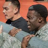 Staff Sgt. Curtis Harper (middle-left) and Senior Airman