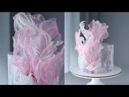 All you is need is some rice cakes, your favorite hummus, and tons of fresh, cut up vegetables to assemble the cutest rice cake flower platter! Rice Paper Decor Rice Paper Decoration Youtube In 2020 Wafer Paper Cake Cake Decorating Videos Cake Decorating Tutorials