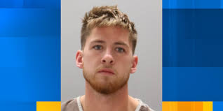 Knoxville man charged after firing rifle