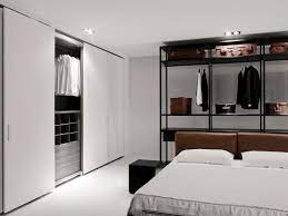 Doors covered in patterned squares create a sophisticated feel for this gorgeous metallic closet. Pin On Hotel Closet