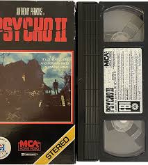 Psycho II [USED][VHS] | Heavy Heads Records |  https://static.wixstatic.com/media/3d1388_b2a445ea718147ebb7a1c25a52a8b291~mv2.png/v1/fit/w_500,h_500,q_90/file.png
