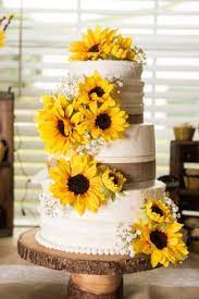 This Backyard Farm Wedding S Got A Ton Of Real Sunflowers Sunflower Wedding Cake Yellow Wedding Cake Sunflower Themed Wedding