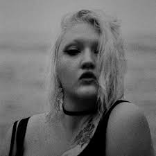 SRSQ (pronounced seer-skew) is the solo project of Them Are Us Too vocalist  and keyboardist Kennedy Ashlyn. Her debut album of beautiful vocal-driven  dark dream pop “Unreality” (produced by Matia Simovich) drops