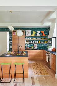 The finish on your kitchen cabinets plays a role in the choice of wall paint colors. 8 Ways To Decorate With Oak Cabinets For A Modern Look Better Homes Gardens