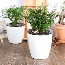 The Big List Of Self Watering Planters For Stylish Gardening Anywhere Self Watering Planter Self Watering Plants Diy Self Watering Planter