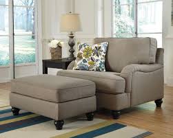This rocker recliner features 15 gauge heat tempered coils, and opulently padded arms. Hariston Chair And A Half With Ottoman Nc Gallery Furniture
