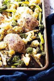 Sheet Pan Chicken Thighs With Broccoli Cauliflower Hurried Health Nut Recipe Pan Chicken Thighs Chicken Thigh Broccoli Recipe Sheet Pan Recipes