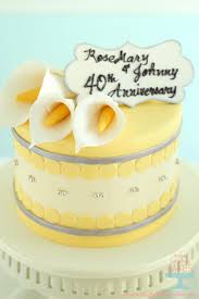 This was made for my parents' ruby wedding anniversary. Yellow And Silver Cakes