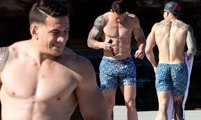 Sonny bill williams (left) and quade cooper's manager khoder nasser (right) has ripped into rugby australia's lack of 'ability to deal with outsiders.' mr nasser slammed rugby australia about the lack of. Sonny Bill Williams Checks His Tackle In Tight Print Shorts As He Enjoys Day On The Beach Daily Mail Online