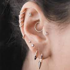 Woukd Love To Get Daith On Both Ears Center Of Cartilage On One And Two Hoops Side By Side On Other Cartilage Ear Peircings Ear Jewelry Cute Ear Piercings