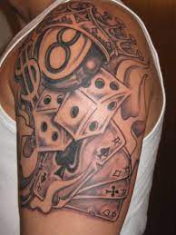 Playing cards tattoo on shoulder. Black And Grey Eight Ball With Playing Cards Tattoo On Shoulder