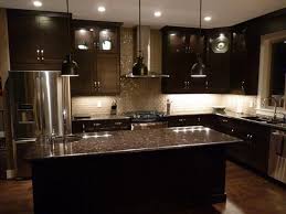 And, the lighter countertops will do a fabulous job of reflecting more light—helping to brighten up the room. Dark Kitchen Cabinets With Light Granite Home Decor Kitchen Backsplash With Dark Cabinets Brown Kitchen Cabinets