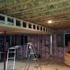In order to put in a drop ceiling, you need to first install a grid system of runners. 1