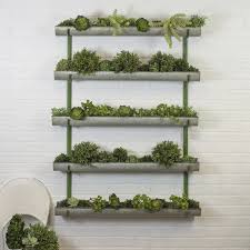 Wall mounted vertical planter indoor or outdoor from industrialfarmco our sleek steel vertical wall planter is a great way to hold and display flower, succulent or herb pots, while taking up little space, for both indoor and outdoor use. Ervine Galvanized Metal Wall Planter Metal Wall Planter Wall Planter Wall Planters Outdoor