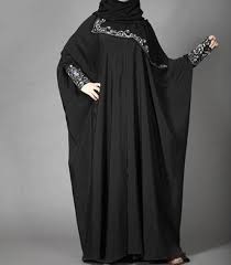 A long, flowing garment that covers the whole body from head to feet, the burka. Pin On Fashion