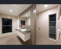 Modern Ensuite With Double Vanities And Floor To Ceiling Tiles In Brisbane Queensland Tru Built Bui Modern Ensuite Lighted Bathroom Mirror Bathroom Lighting