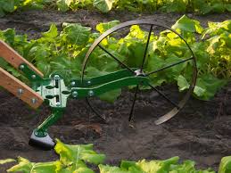 These tools are a great asset to our homestead.#higharchwheelhoe#hosstools#. Hoss Single Wheel Hoe With Sweeps Attachments Make Weeding Your Garden Easy With This Versatile Tool Amish Made Hardwood Han Garden Tools Garden Farm Tools
