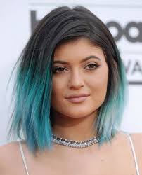 Black hair and green eyes. Kylie Jenner Dyes Her Hair Bright Blue For New Years