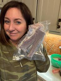 Wood carving of deer and fawn needs appreciation