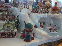 Many of these products are run by batteries or electricity, with most of them having the flexibility of being plugged in anywhere there is a power outlet. Custom Christmas Village Display Services Etsy Christmas Village Display Christmas Display Lemax Christmas Village