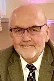 John W. Zackasee 1946-2023